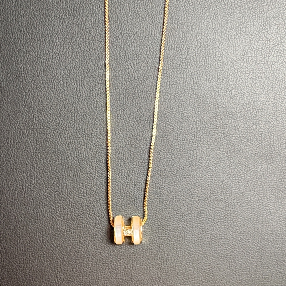 Mother of Pearl Gold Necklace with small
initial H Pendant